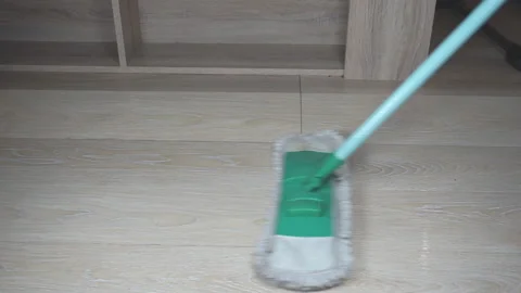 A man washes the floor in the room. Stock Footage 130411281