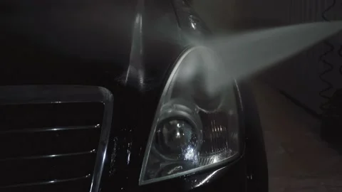 Man washes the foam from the car Stock Footage 165152629