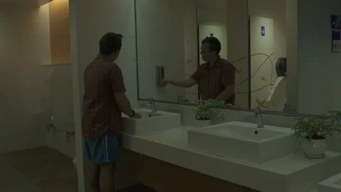 A man washes hands with soap at tualee airport Stock Footage 92261532