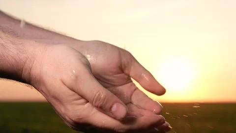 Man washes hands sunset, taking care hygiene cleanliness. people strive ensure Stock Footage 272587976