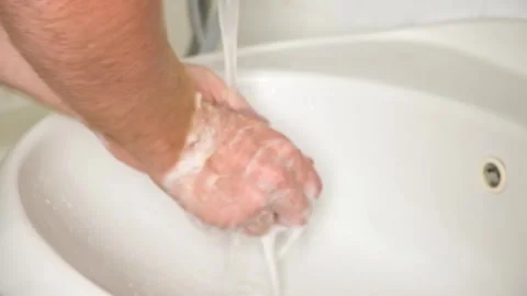 Man washes hhands with soap. Man hands in foam with bubbles Wash your hands Stock Footage 246641280