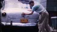 Man Washes His 1953 Ford In Driveway 1950S Vintage Film Home Movie 1709 Stock Footage