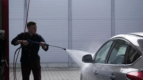 The man washes his car Stock Footage 248718555