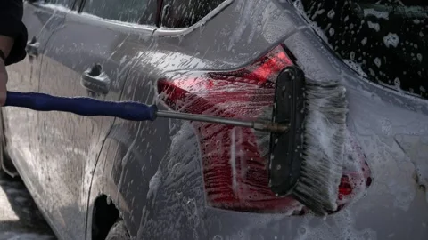 The man washes his car Stock Footage 249054270