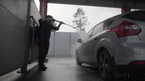 The man washes his car 스톡 동영상 254166275