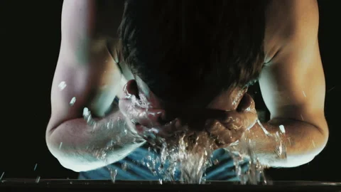 A Man Washes His Face with Water. Trying to Come to His Senses and Restore Stock Footage 257539318