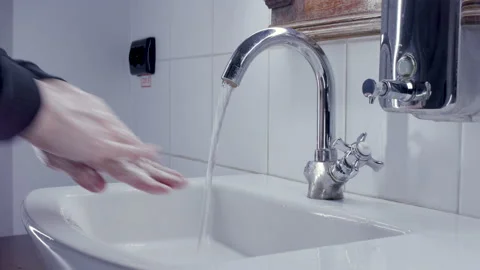 A man washes his hands in best way. Stock Footage 134699986