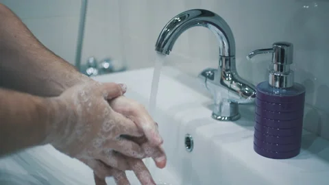 Man washes his hands carefully Stock Footage 142606320