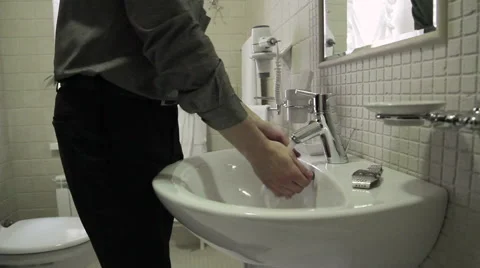 Man washes his hands Stock Footage 47557844
