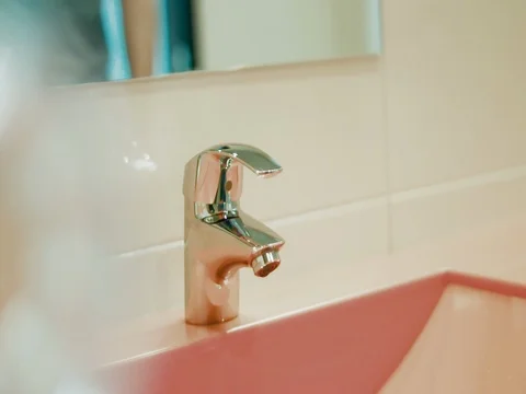 A man washes his hands Stock Footage 77055023