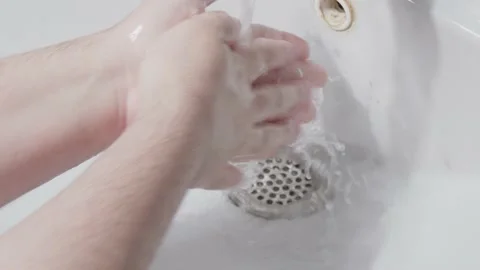 Man washes his hands Stock Footage 163364847