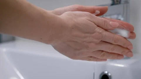 A man washes his hands in his bathroom. Men's hands in the frame, a modern house Stock Footage 129005324