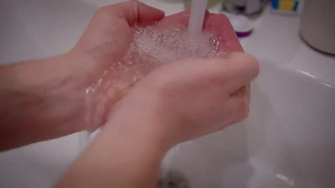 A man washes his hands, hygiene and preventing germs from getting on hands Stock Footage 303621713
