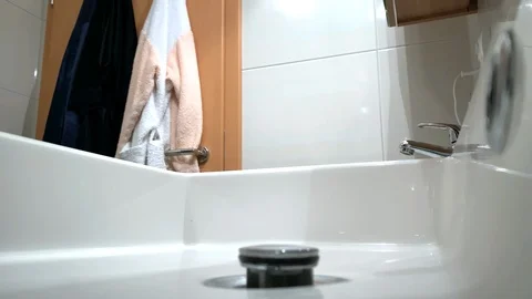 Man washes his hands in the sink Stock Footage 122589983