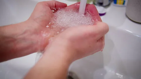 Man washes his hands in a sink, hygiene and prevention of germs on the hands Stock Footage 300085092