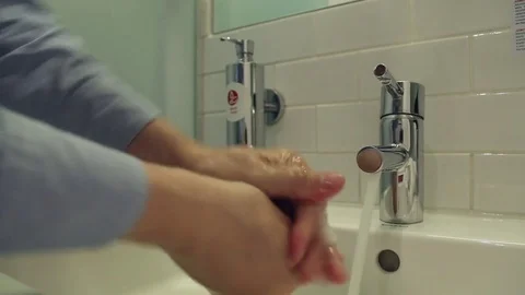 Man washes his hands with soap Stock Footage
