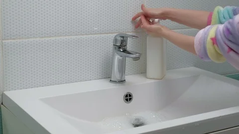 A man washes his hands with soap in the bathroom. Hygiene Video stock 127506964