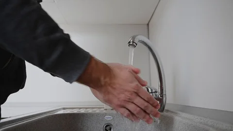 A man washes his hands with soap Stock Footage 127834792