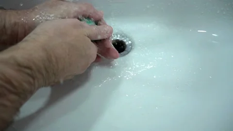 Man washes his hands with soap in slow motion. Stock Footage 129550801
