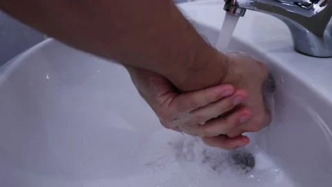A man washes his hands soap water antiseptic Stock Footage 169326214
