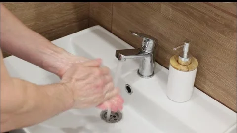 A man washes his hands with soap Stock Footage 270923355