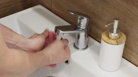A man washes his hands with soap Stock Footage 270923359