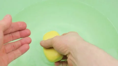 A man washes his hands with solid soap close-up.Washing hands with solid soap Stock Footage 195706319