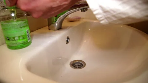 Man washes his hands under the tap Stock-Footage 56538493