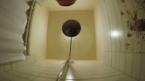 A man washes his head in the shower Stock Footage 106958727