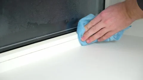 A man washes the joints on window with a steam cleaner. Steam cleaner for Stock Footage 171226229