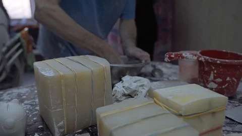 A man washes a metal plate in the workshop Stock Footage 102258545