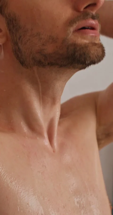 A man washes in the shower 스톡 동영상 287822208