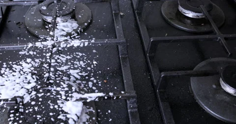 A man washes the stove Stock Footage 115758499