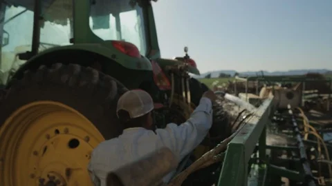 Man Washes Tractor Stock Footage 95614171