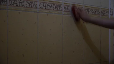 Man washes the wall with a brush Stock Footage 126093199