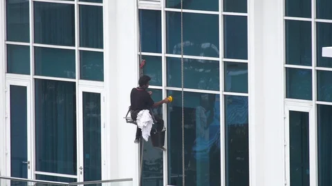 The man washes the window Stock Footage 94037202