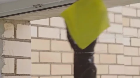 Man washes the windows with special foam and cleans them. Cleaning service. Stock Footage 196279914