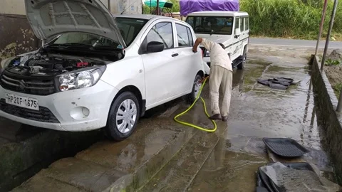 A man is washing the car in the service centre. Stock Footage 143409341