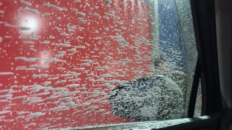 Man is washing car. View from inside the automobile. Close-up. Man is washing Stock Footage 271346509