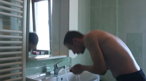 Man washing face Stock Footage 55533216