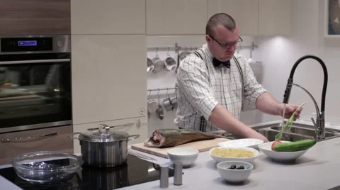 Man washing green onions in the sink Stock Footage 59190215