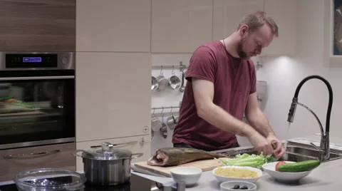 Man washing greens in the sink Stock Footage 59185747
