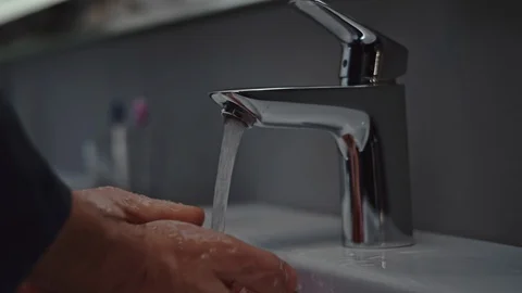 Man washing hands in bath Stock Footage 107321198