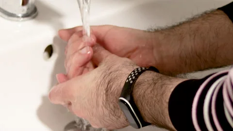 Man is washing hands in bathroom to remove dirt Video stock 191043726