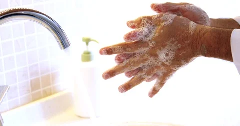 Man washing hands properly with soap to be protected for Coronavirus. Stock Footage 128536866