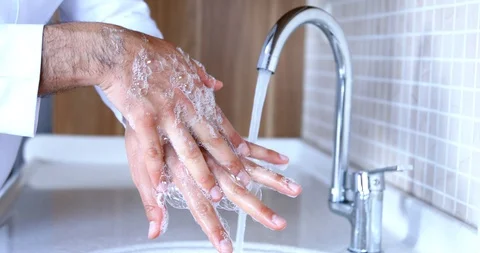 Man washing hands properly with soap to be protected for Coronavirus. Stock Footage 128537258