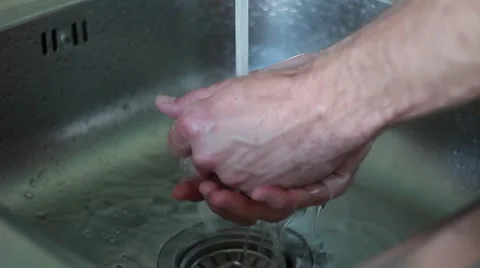 Man washing hands with soap Vídeos de archivo 63456162