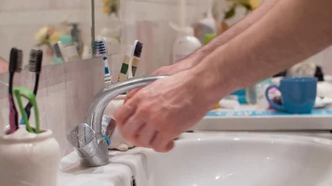 Man washing his hands Stock Footage 128916339