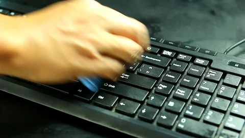 Man washing keyboard of personal computer in studio, Chiangmai Thailand Stock-Footage 115776965