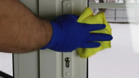 Man is washing a plastic door handle Stock Footage 147654089